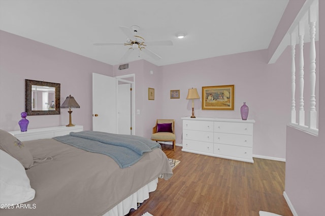 bedroom featuring wood-type flooring and ceiling fan