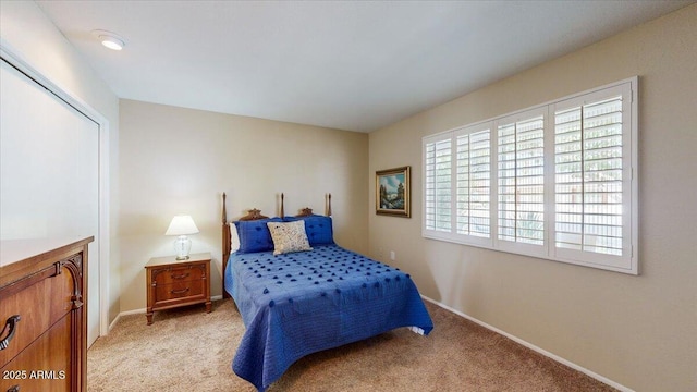 10506 W Desert Forest Cir, Sun City, AZ 85351 - bedroom with light colored carpet and baseboards