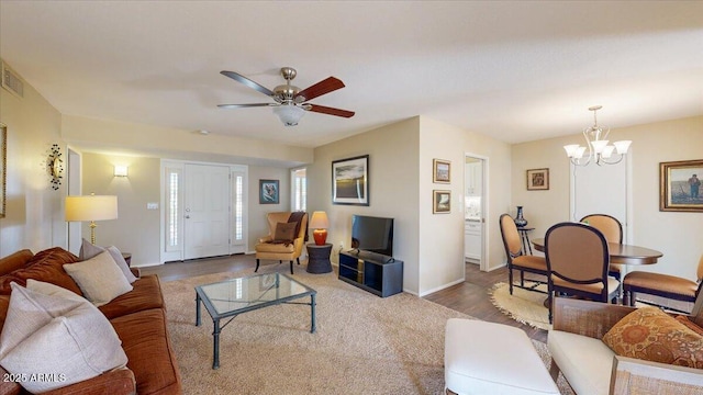 10506 W Desert Forest Cir, Sun City, AZ 85351 - living room with baseboards, a chandelier, and ceiling fan