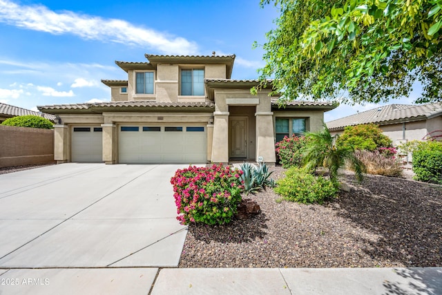 19242 W Pasadena Ave, Litchfield Park, AZ 85340 - view of front of property with concrete driveway, stucco siding, a garage, and a tiled roof