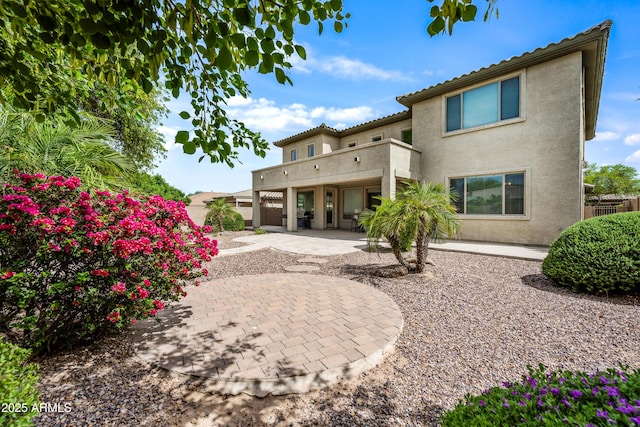 19242 W Pasadena Ave, Litchfield Park, AZ 85340 - back of property featuring a patio area, stucco siding, and a tile roof