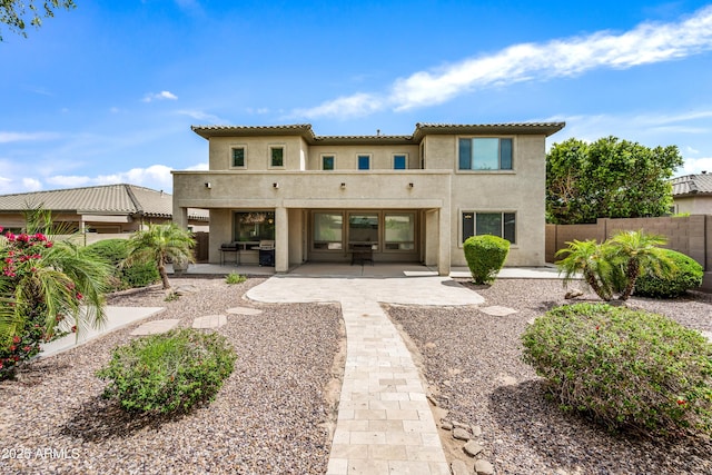 19242 W Pasadena Ave, Litchfield Park, AZ 85340 - rear view of property featuring stucco siding, a patio, and a tile roof