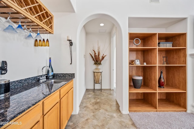 19242 W Pasadena Ave, Litchfield Park, AZ 85340 - indoor bar featuring arched walkways and light tile patterned flooring