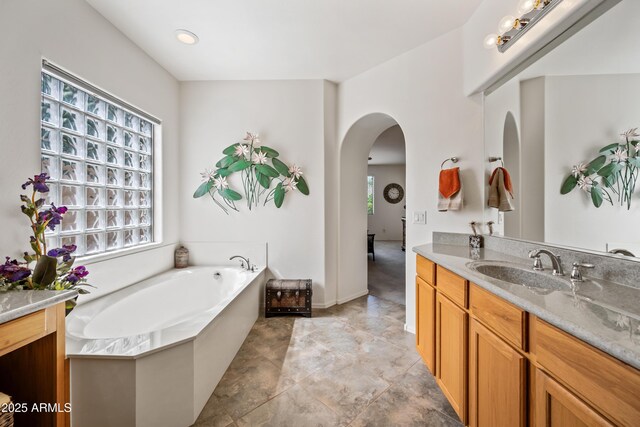 19242 W Pasadena Ave, Litchfield Park, AZ 85340 - full bathroom featuring vanity and a garden tub