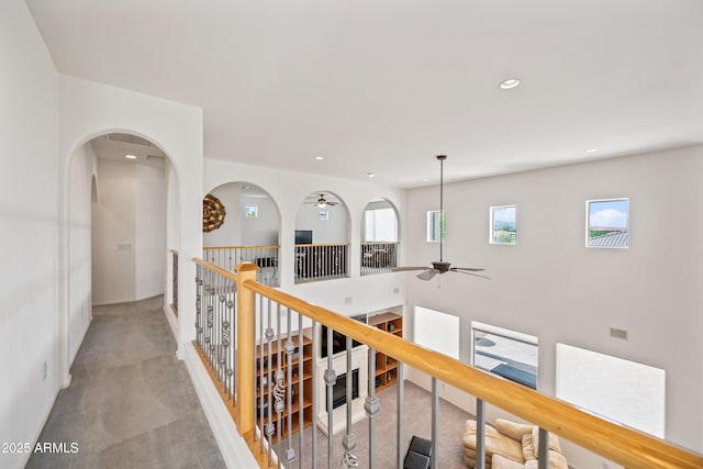 19242 W Pasadena Ave, Litchfield Park, AZ 85340 - hallway with light colored carpet, recessed lighting, baseboards, and arched walkways