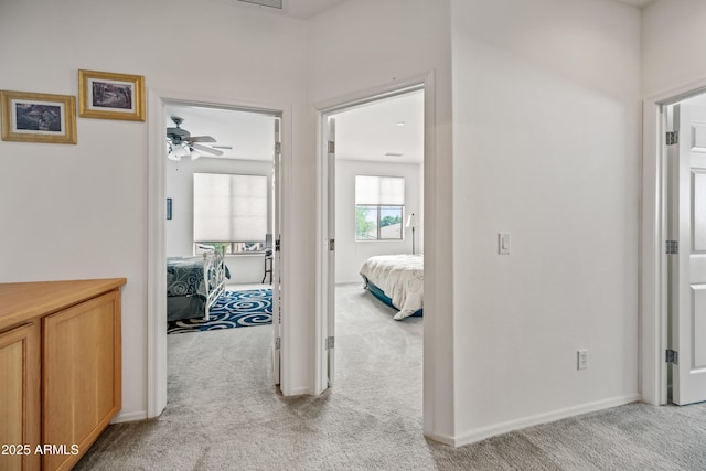 19242 W Pasadena Ave, Litchfield Park, AZ 85340 - hall featuring light carpet and baseboards