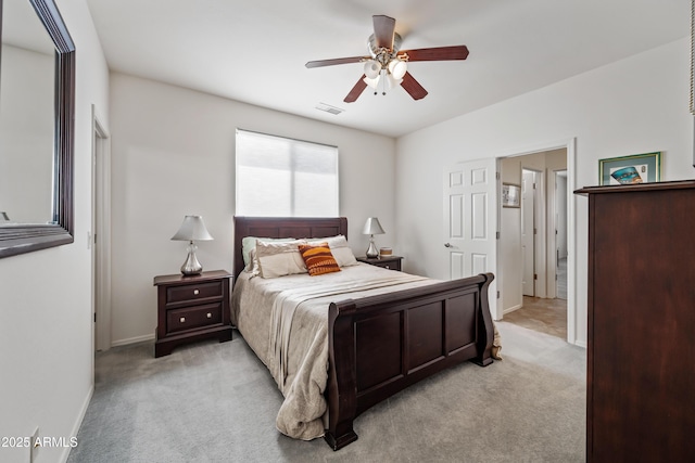 19242 W Pasadena Ave, Litchfield Park, AZ 85340 - bedroom with light colored carpet, baseboards, and ceiling fan