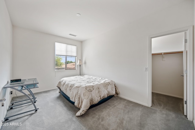 19242 W Pasadena Ave, Litchfield Park, AZ 85340 - bedroom featuring carpet floors, a spacious closet, baseboards, and a closet