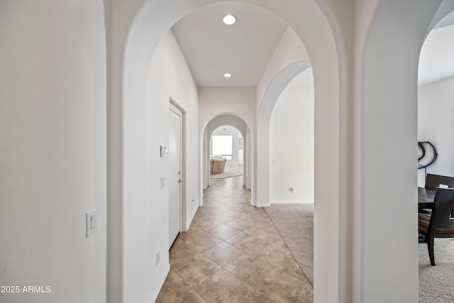 19242 W Pasadena Ave, Litchfield Park, AZ 85340 - corridor featuring arched walkways, recessed lighting, carpet floors, baseboards, and tile patterned floors