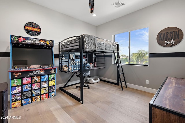 bedroom with wood-type flooring