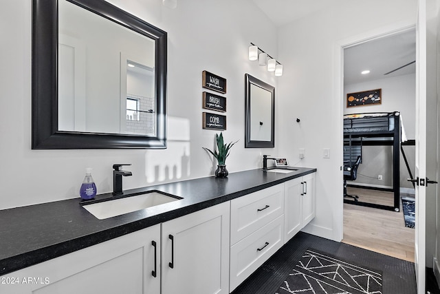 bathroom with vanity and hardwood / wood-style flooring