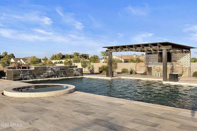 view of pool with an in ground hot tub, a patio area, and pool water feature