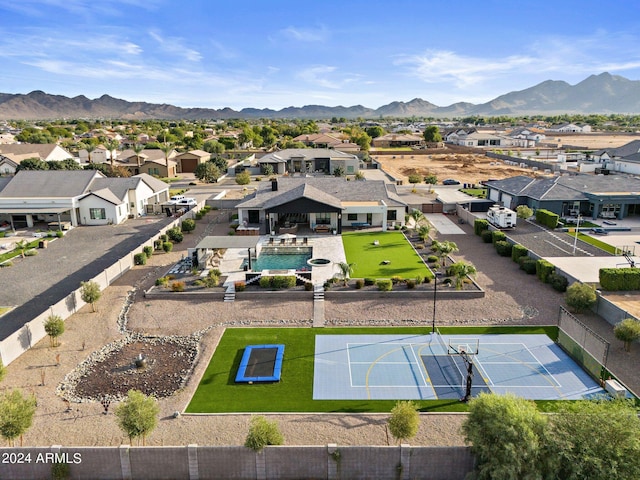 birds eye view of property with a mountain view