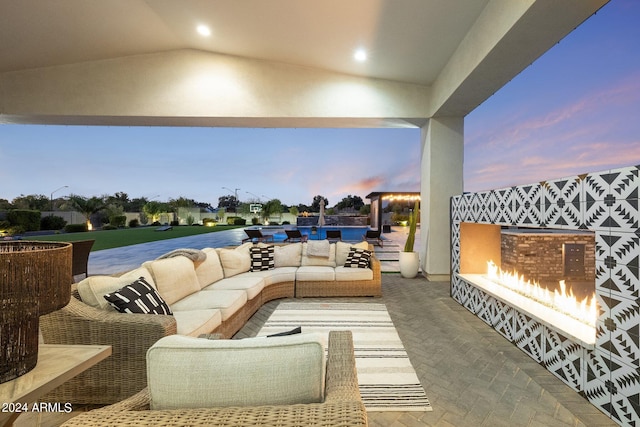 patio terrace at dusk with an outdoor living space