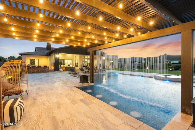 pool at dusk featuring a pergola and a patio area