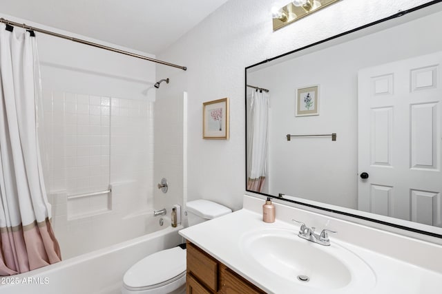 bathroom with vanity, shower / tub combo with curtain, and toilet