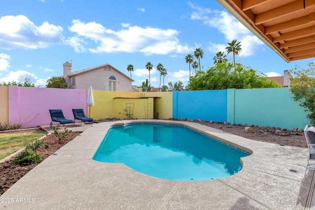 view of pool with a patio, a fenced in pool, and a fenced backyard