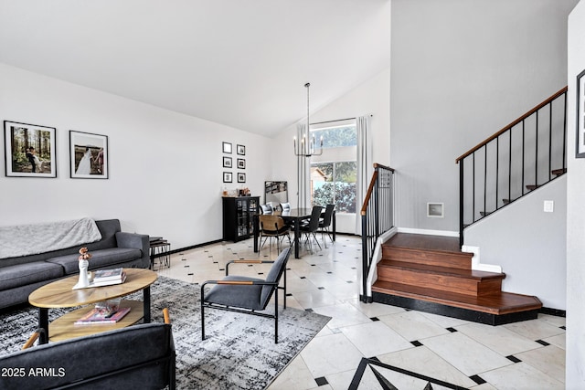 living area featuring an inviting chandelier, stairs, baseboards, and high vaulted ceiling