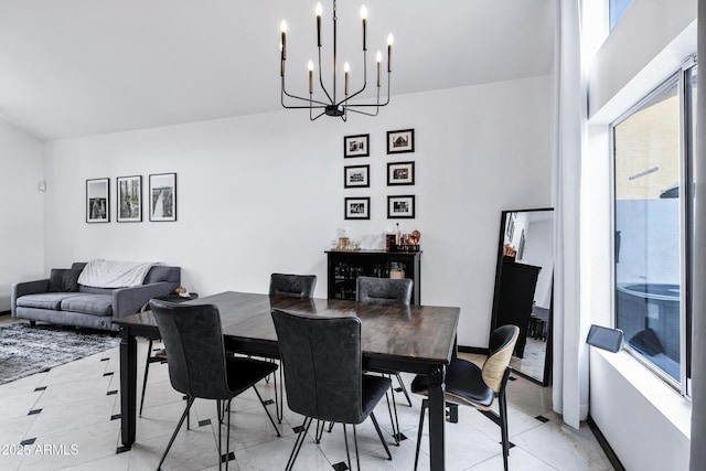 dining area featuring a notable chandelier