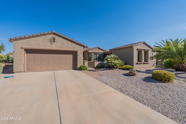 ranch-style house featuring a garage