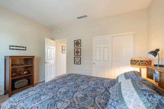 carpeted bedroom featuring a closet