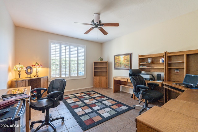 home office featuring tile patterned flooring and ceiling fan