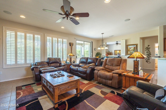 living room with ceiling fan and tile patterned floors