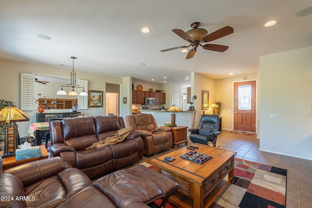 living room with light tile patterned flooring and ceiling fan