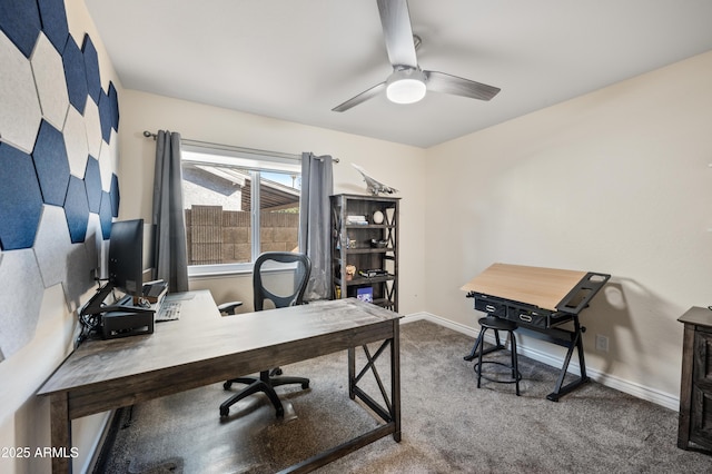 carpeted home office featuring ceiling fan