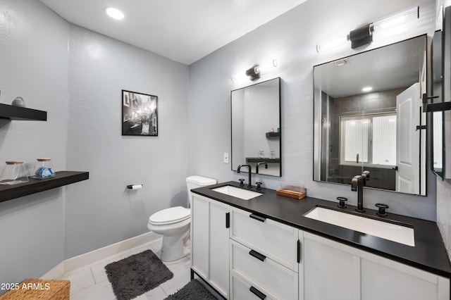 bathroom with vanity, an enclosed shower, and toilet