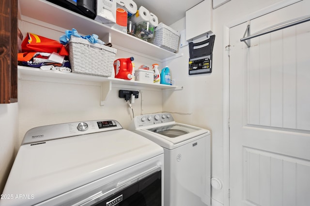 laundry room with washing machine and clothes dryer