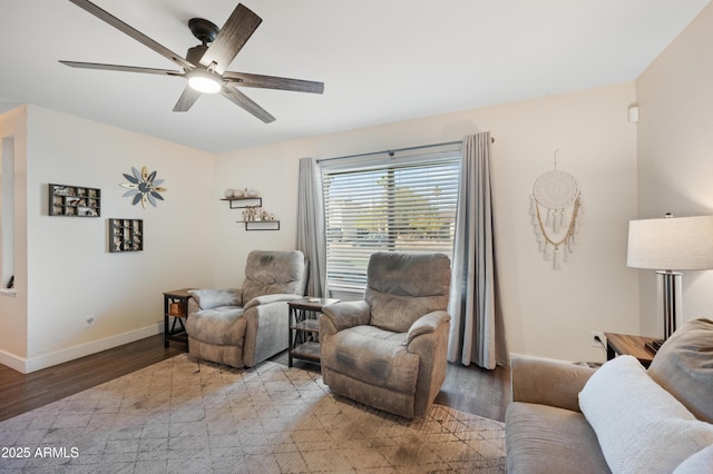 living area with ceiling fan and light hardwood / wood-style floors