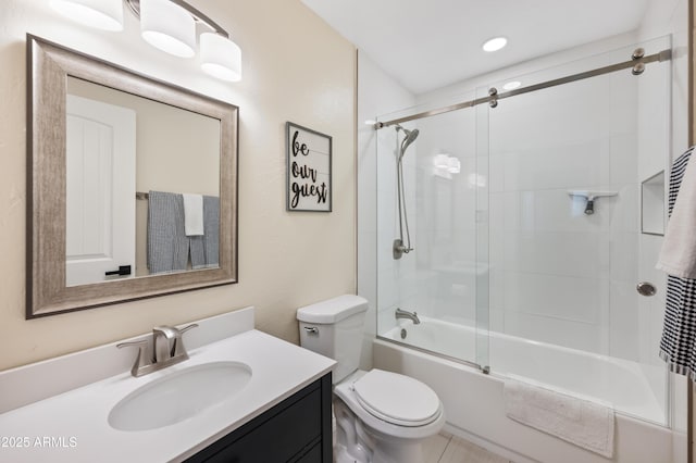 full bathroom with vanity, combined bath / shower with glass door, and toilet