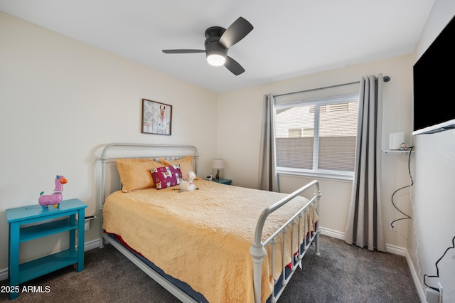 bedroom with ceiling fan and dark colored carpet