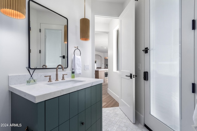 bathroom featuring wood-type flooring and vanity