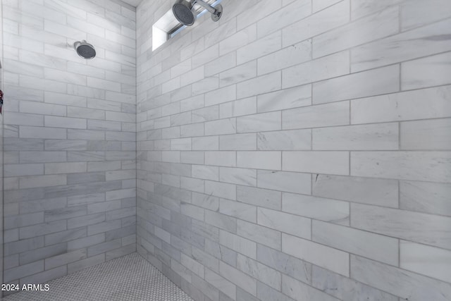 bathroom with tiled shower