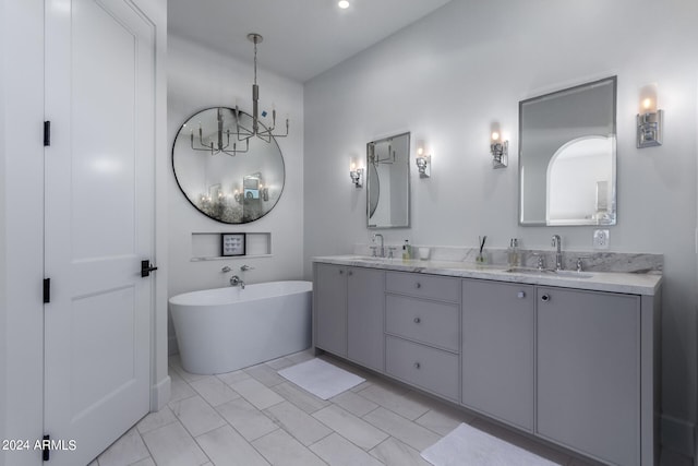 bathroom featuring vanity and a tub