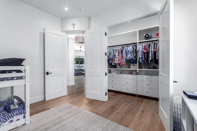 bedroom featuring a closet and light hardwood / wood-style flooring