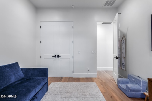 sitting room featuring light hardwood / wood-style floors