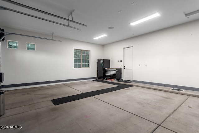 garage featuring black refrigerator