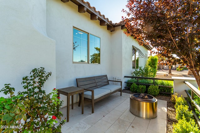 view of patio / terrace featuring an outdoor living space with a fire pit