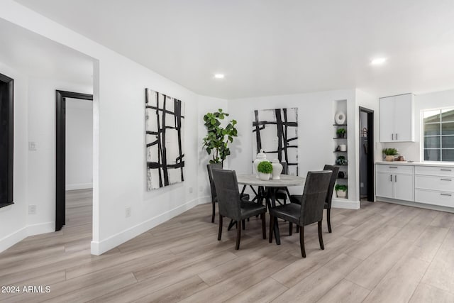 dining area with light wood-type flooring