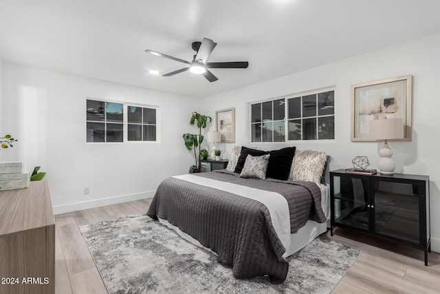 bedroom featuring ceiling fan and light hardwood / wood-style floors