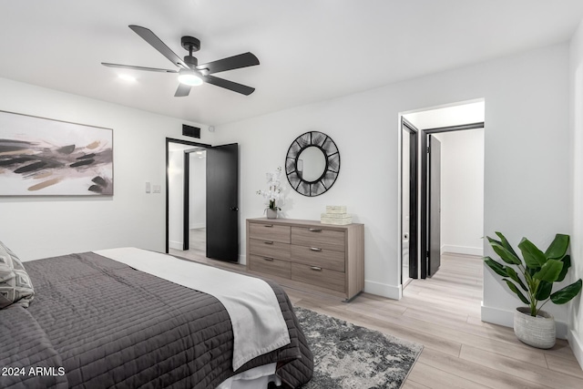 bedroom featuring light hardwood / wood-style flooring and ceiling fan