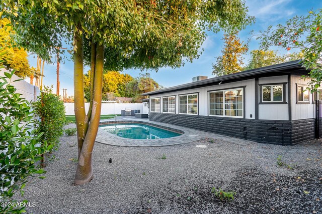 view of swimming pool with a patio area