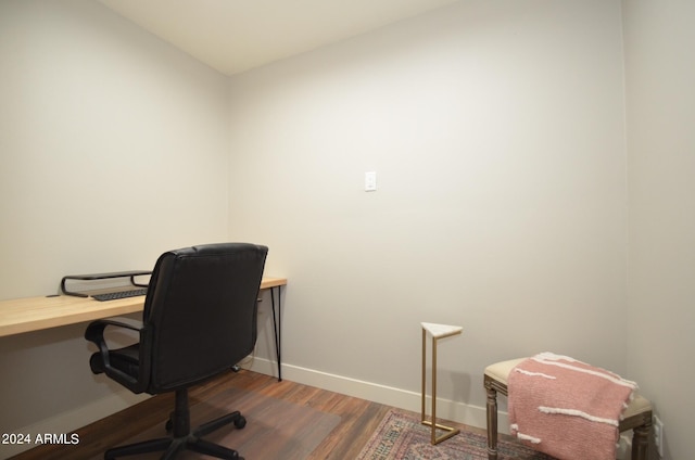 office with dark hardwood / wood-style floors