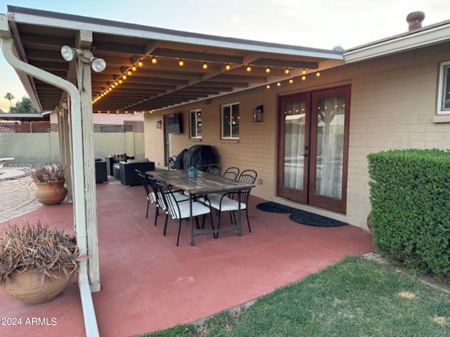 view of patio / terrace with area for grilling and french doors