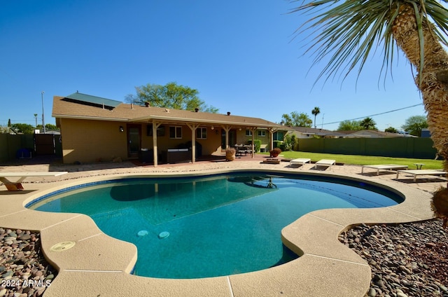 view of swimming pool with a patio area