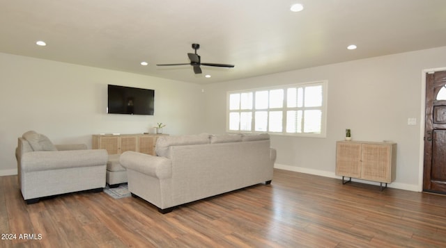 living room featuring hardwood / wood-style flooring and ceiling fan