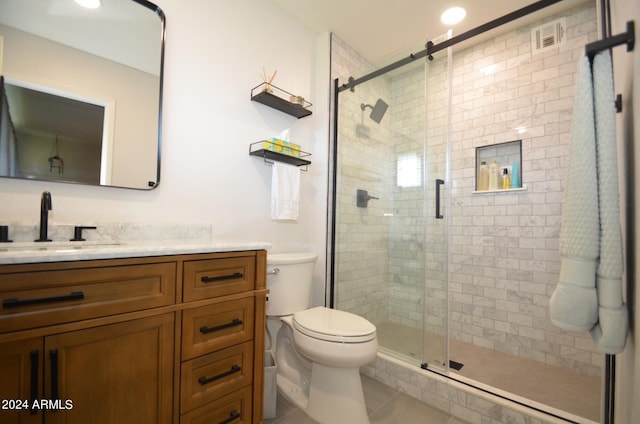 bathroom with walk in shower, tile patterned flooring, vanity, and toilet